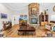 Living room featuring a large stone fireplace and hardwood floors at 13924 Island Dr, Huntersville, NC 28078