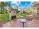 Outdoor patio with stone fireplace and seating area at 13924 Island Dr, Huntersville, NC 28078