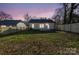 House backyard view at dusk at 1420 Beechwood Dr, Gastonia, NC 28052