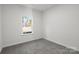 Simple bedroom with grey carpet and a window at 1420 Beechwood Dr, Gastonia, NC 28052