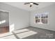 Bedroom with gray carpet, ceiling fan, and window at 1420 Beechwood Dr, Gastonia, NC 28052