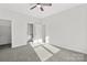 Bedroom with gray carpet, ceiling fan, and en-suite bathroom at 1420 Beechwood Dr, Gastonia, NC 28052