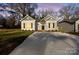 Charming new construction home with a gray and white exterior at dusk at 1420 Beechwood Dr, Gastonia, NC 28052