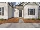 Front entrance of a freshly painted new home with dark gray shutters at 1420 Beechwood Dr, Gastonia, NC 28052