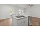 Kitchen island with double sink and stainless steel dishwasher at 1420 Beechwood Dr, Gastonia, NC 28052