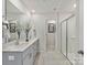 Modern bathroom with double vanity, quartz countertop and walk-in shower at 1420 Windy Park Dr, Stanley, NC 28164