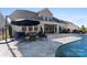 Private backyard oasis with pool, patio, and firepit at 14206 Morningate St, Huntersville, NC 28078