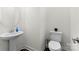 Stylish powder room with pedestal sink and toilet at 14206 Morningate St, Huntersville, NC 28078