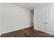 Empty bedroom with hardwood floors and double doors to closet at 14206 Morningate St, Huntersville, NC 28078