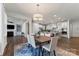 Open concept kitchen and dining area with island and stainless steel appliances at 14206 Morningate St, Huntersville, NC 28078