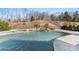 Relaxing pool with spa and a waterfall feature at 14206 Morningate St, Huntersville, NC 28078