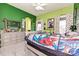 A bright bedroom featuring green walls, white trim, polka dot curtains, and Marvel themed decor at 1467 Kensington Park Ct, Hickory, NC 28602