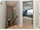 A view from the stairwell into a bonus room space, featuring carpeted floors and bright blue walls at 1467 Kensington Park Ct, Hickory, NC 28602