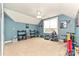 A bonus room space featuring carpeted floors and bright blue walls at 1467 Kensington Park Ct, Hickory, NC 28602