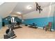 Bright home gym with carpeted floors, exercise equipment, pull-up bar, and desk area at 1467 Kensington Park Ct, Hickory, NC 28602