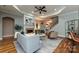 Comfortable living room with a tray ceiling, fireplace, and staircase, designed for relaxation at 1467 Kensington Park Ct, Hickory, NC 28602