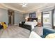 A beautifully carpeted main bedroom showcasing art, a large window, recessed lights, and a comfortable bed at 1467 Kensington Park Ct, Hickory, NC 28602