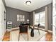 Cozy home office with natural light, complemented by hardwood floors and neutral tones at 1467 Kensington Park Ct, Hickory, NC 28602