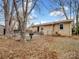 Fenced backyard with mature trees and a patio at 1500 Collier Ct, Charlotte, NC 28205