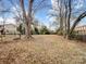 Large backyard with mature trees and open space at 1500 Collier Ct, Charlotte, NC 28205