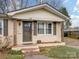 Brick ranch home with a charming front porch at 1500 Collier Ct, Charlotte, NC 28205