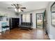 Living room features hardwood floors, a ceiling fan and a comfortable couch at 1500 Collier Ct, Charlotte, NC 28205