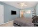 Bright bedroom with double bed, TV, and ceiling fan at 159 Kallie Loop, Mooresville, NC 28117