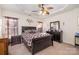 Main bedroom with ceiling fan and ensuite bathroom at 159 Kallie Loop, Mooresville, NC 28117