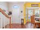 Bright entryway with hardwood floors and view into the dining area at 159 Kallie Loop, Mooresville, NC 28117