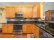 Kitchen with stainless steel appliances and granite countertops at 159 Kallie Loop, Mooresville, NC 28117