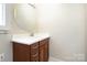 Bathroom with a vanity, round mirror and tiled floor at 1610 Elkhart Cir, Gastonia, NC 28054