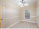 Bright breakfast area with tiled floor and neutral colors at 1610 Elkhart Cir, Gastonia, NC 28054