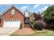 Brick house with a two-car garage and landscaped front yard at 1610 Elkhart Cir, Gastonia, NC 28054