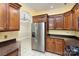 Stainless steel appliances and wood cabinets in this kitchen at 1610 Elkhart Cir, Gastonia, NC 28054