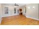 Hardwood floor living room, fireplace, and access to kitchen at 1610 Elkhart Cir, Gastonia, NC 28054