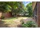 Brick patio surrounded by lush green landscaping at 1610 Elkhart Cir, Gastonia, NC 28054