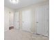 Bedroom with neutral walls, carpeting, and multiple closets at 1620 #G Arlyn Cir, Charlotte, NC 28213