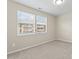 Bright bedroom with neutral walls, carpeting, and two windows at 1620 #G Arlyn Cir, Charlotte, NC 28213