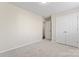 Bedroom with neutral walls, carpeting, and double-door closet at 1620 #G Arlyn Cir, Charlotte, NC 28213