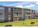 Brick condo building with balconies and ample green space at 1620 Arlyn Cir # G, Charlotte, NC 28213