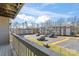 Community view from balcony showcasing ample parking and surrounding buildings at 1620 #G Arlyn Cir, Charlotte, NC 28213