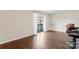 Living area with hardwood floors and access to balcony at 1620 Arlyn Cir # G, Charlotte, NC 28213