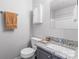 Cozy bathroom with a sleek vanity, granite countertop, and built-in storage at 1620 #G Arlyn Cir # G, Charlotte, NC 28213