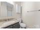 Stylish bathroom featuring granite countertop, white fixtures, and ample storage at 1620 #G Arlyn Cir # G, Charlotte, NC 28213
