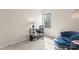 Bright bedroom with a modern desk, comfortable chair, and large window at 1620 #G Arlyn Cir # G, Charlotte, NC 28213