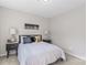 A bedroom with carpet features a bed with night stands and lamps at 1620 #G Arlyn Cir # G, Charlotte, NC 28213
