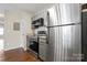 The kitchen has stainless steel appliances, granite counters, and grey cabinets at 1620 #G Arlyn Cir # G, Charlotte, NC 28213