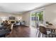 Bright living room featuring sliding glass doors to a balcony and modern furnishings at 1620 #G Arlyn Cir # G, Charlotte, NC 28213