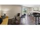 Comfortable seating arrangement in the living room with natural light from the sliding glass door at 1620 #G Arlyn Cir # G, Charlotte, NC 28213
