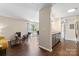 Open-concept living space with sleek wood flooring, kitchen, and access to the balcony at 1620 #G Arlyn Cir # G, Charlotte, NC 28213